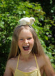 Cute girl holding on the head  yellow chick