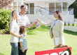 Realtor handing family the keys to their new house