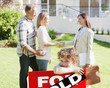 Realtor congratulating family on buying new house