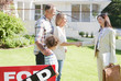 Realtor congratulating family on buying their new house