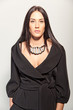 Portrait of a beautiful brunette in a stylish fashion pantsuit