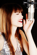 young artist woman recording in a studio young artist woman recording in a studio