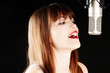 young artist woman recording in a studio young artist woman recording in a studio