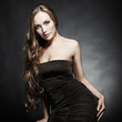 Photo: Portrait of young beautiful woman in an elegant evening dress Portrait of young beautiful woman in an elegant evening dress