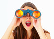 Surprised girl with binoculars