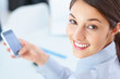 Cute female executive using mobile phone
