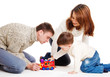Kid and his parents playing
