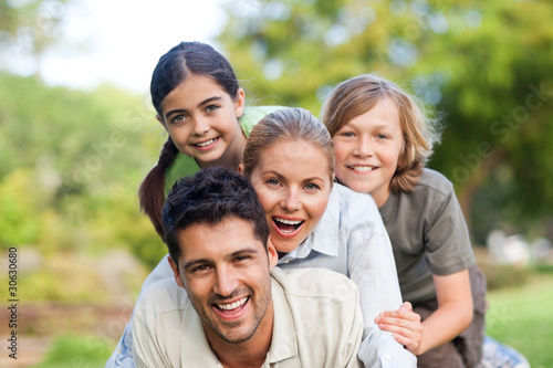 Photo: Happy family in the park Happy family in the park