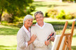 Retired couple painting in the park Retired couple painting in the park