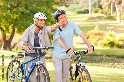 Photo: Mature couple with their bikes Mature couple with their bikes