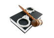 Judge's gavel and handcuffs on black legal book