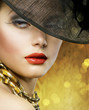 Beautiful Woman over luxury gold background