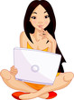 Young Asiatic woman sitting on cushion with laptop