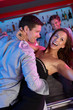 Couple Having Fun In Busy Bar