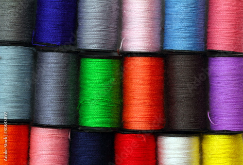 Foto: lot of colored thread spools lot of colored thread spools