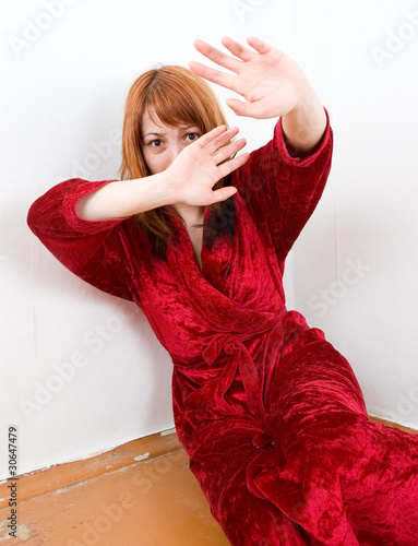 Photo: Scared abused woman is hiding Scared abused woman is hiding