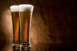 Beer into glass on a old stone Beer into glass on a old stone