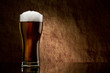 Beer into glass on a old stone Beer into glass on a old stone