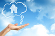The House in the hands against the blue sky The House in the hands against the blue sky