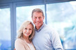 Happy couple close together at home