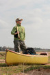MAn with oar near the canoe