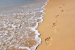 Footmarks on the sandy beach ..