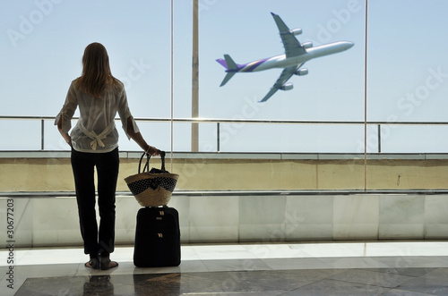 Photo: Girl at the airport window Girl at the airport window