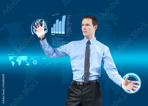 Foto: Businessman navigating holographic virtual interface Businessman navigating holographic virtual interface