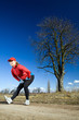 Woman stretches after cross country running Woman stretches after cross country running