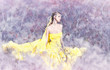 Foto: Young beautiful girl in a yellow dress in the woods Young beautiful girl in a yellow dress in the woods