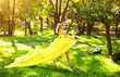 Foto: Young beautiful girl in a yellow dress in the woods Young beautiful girl in a yellow dress in the woods