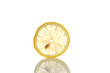 Single cross section of lemon. Isolated on white background.