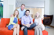 Parents and adult children on couch