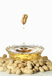 Flow out of the peanut oil, isolated on a white background.