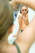 Girl taking photo of friend with cell phone