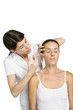 Woman having Botox injection, eyes closed
