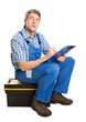 Confident service man taking notes