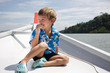 young boy traveling on boat