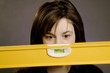 Woman Holding A Spirit Level