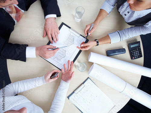 Photo: Group of architects at their office Group of architects at their office