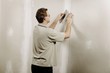 Man Using A Putty Knife