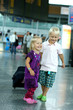 Photo: Children at the airport. They are ready for traveling Children at the airport. They are ready for traveling