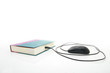 Photo: PC mouse pugged into a book, on white PC mouse pugged into a book, on white