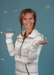 woman holding soap bubble