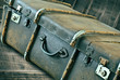 Vintage Suitcase a on wooden background. Closeup