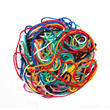 ball of multicolored woolen threads on white