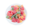 sugar coated gumdrops in a bowl isolated sugar coated gumdrops in a bowl isolated