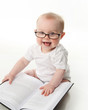Baby reading with glasses