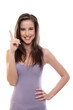 young brunette woman smiling and pointing