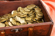 coins in a wooden box